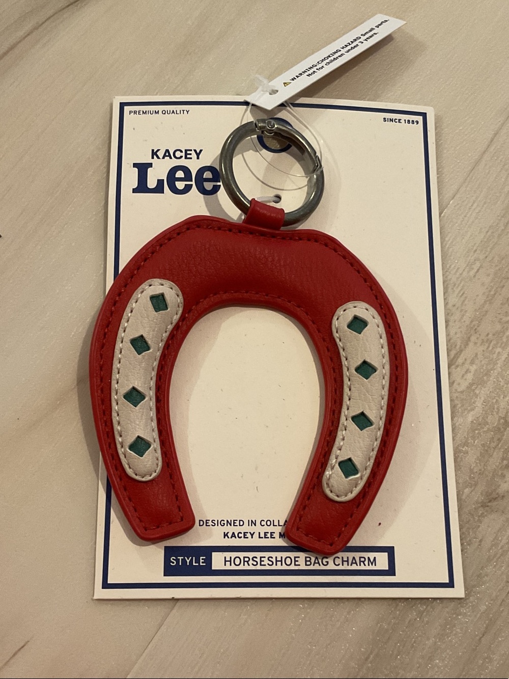 Lee by Kasey Musgraves Red Horseshoe Bag Charm with White and Green Accents